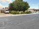 This house features a large tree and a well-maintained front yard at 5815 N 61St Ln, Glendale, AZ 85301