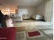 Comfortable living area with a view into the kitchen, providing an open floorplan at 5815 N 61St Ln, Glendale, AZ 85301