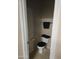 Small bathroom with a toilet and a towel rack, simple and functional at 6629 W Polk St, Phoenix, AZ 85043