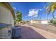 Backyard featuring desert landscaping, privacy fence, and view of nearby homes at 67 S Amulet Ave, Mesa, AZ 85208