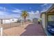 Large backyard with shed, palm tree and space to relax or entertain with desert landscaping at 67 S Amulet Ave, Mesa, AZ 85208