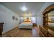 Spacious bedroom with traditional decor, including a wooden dresser and nightstands at 67 S Amulet Ave, Mesa, AZ 85208