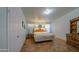Bright bedroom with classic wooden furniture, providing a cozy and inviting atmosphere at 67 S Amulet Ave, Mesa, AZ 85208