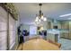 Open-concept dining room with views into the living room and kitchen at 67 S Amulet Ave, Mesa, AZ 85208