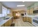 Bright open kitchen featuring modern appliances, and eat-in dining space at 67 S Amulet Ave, Mesa, AZ 85208