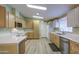 Charming kitchen with modern cabinets and white appliances, ample countertop space, and lots of light at 67 S Amulet Ave, Mesa, AZ 85208