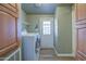 Efficient laundry room equipped with modern washer and dryer, and ample storage at 67 S Amulet Ave, Mesa, AZ 85208