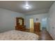 Bedroom with wood furniture offering ample storage with two closets and ensuite access at 67 S Amulet Ave, Mesa, AZ 85208