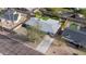 Aerial view of the house, large driveway and mature trees in a fenced-in yard at 7041 E Cypress St St, Scottsdale, AZ 85257