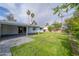 Lush backyard with a covered patio, mature trees, and plenty of space for activities at 7041 E Cypress St St, Scottsdale, AZ 85257