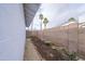 An enclosed backyard features a garden bed and cinder block wall for privacy at 7041 E Cypress St St, Scottsdale, AZ 85257