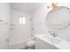 Bright bathroom features white subway tile in shower and modern vanity with round mirror at 7041 E Cypress St St, Scottsdale, AZ 85257