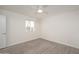 Empty bedroom with gray flooring, ceiling fan, and a bright window at 7041 E Cypress St St, Scottsdale, AZ 85257