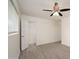 Bedroom featuring gray flooring, an open closet, and a window at 7041 E Cypress St St, Scottsdale, AZ 85257