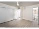 Empty bedroom with gray flooring, closet, and bathroom access at 7041 E Cypress St St, Scottsdale, AZ 85257