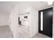 Inviting entryway showcases open floor plan with views of the modern kitchen and stylish lighting at 7041 E Cypress St St, Scottsdale, AZ 85257