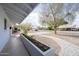 View of the home's front exterior with desert landscaping and covered walkway at 7041 E Cypress St St, Scottsdale, AZ 85257