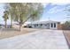 Beautiful single-story home with a well-manicured front yard and extra wide driveway at 7041 E Cypress St St, Scottsdale, AZ 85257