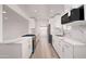 Bright kitchen featuring white cabinets, stainless steel appliances, and marble countertops at 7041 E Cypress St St, Scottsdale, AZ 85257