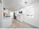 Bright, open kitchen with white cabinets, stainless steel appliances, and wood-look flooring at 7041 E Cypress St St, Scottsdale, AZ 85257