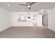 Spacious living room with new gray flooring and open view into the kitchen at 7041 E Cypress St St, Scottsdale, AZ 85257