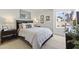Cozy bedroom featuring a comfortable bed, stylish decor, and a bright window view at 7350 N Via Paseo Del Sur -- # P107, Scottsdale, AZ 85258