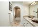 Elegant bathroom featuring tiled floor and a shower over tub with arched entry at 7500 E Mccormick Pkwy # 73, Scottsdale, AZ 85258