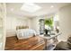 Bright bedroom featuring hardwood floors, a built-in Murphy bed, and a skylight for ample natural light at 7500 E Mccormick Pkwy # 73, Scottsdale, AZ 85258