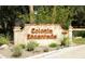 Elegant community sign reading 'Colonia Encantada' nestled amongst lush landscaping at 7500 E Mccormick Pkwy # 73, Scottsdale, AZ 85258