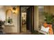 Open doorway reveals elegant chandeliers and a glimpse of the living room at 7500 E Mccormick Pkwy # 73, Scottsdale, AZ 85258