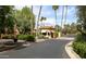 Well-maintained community guard house at the gated entrance, surrounded by lush landscaping at 7500 E Mccormick Pkwy # 73, Scottsdale, AZ 85258