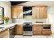 Modern kitchen with stainless steel appliances, white subway tile backsplash, and island at 7500 E Mccormick Pkwy # 73, Scottsdale, AZ 85258