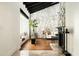 Inviting living room featuring hardwood floors and a stone accent wall at 7500 E Mccormick Pkwy # 73, Scottsdale, AZ 85258
