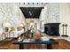 Open-concept living room with stone accent wall and elegant furnishings at 7500 E Mccormick Pkwy # 73, Scottsdale, AZ 85258
