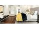 Comfortable bedroom featuring neutral decor, wood floors, and bench seating at 7500 E Mccormick Pkwy # 73, Scottsdale, AZ 85258