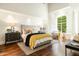 Bright bedroom with large window, decorative rug, and ample natural light at 7500 E Mccormick Pkwy # 73, Scottsdale, AZ 85258