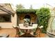 Relaxing patio with a dining table and chairs, surrounded by beautiful landscaping and shaded by a pergola at 7500 E Mccormick Pkwy # 73, Scottsdale, AZ 85258