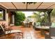 Inviting patio area with comfortable lounge seating and a pergola, surrounded by greenery at 7500 E Mccormick Pkwy # 73, Scottsdale, AZ 85258