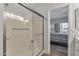 Bathroom shower with glass door adjacent to the bedroom at 7675 E Mcdonald Dr # 107, Scottsdale, AZ 85250