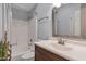 Well-lit bathroom featuring a shower-tub combo with a white ceramic tile surround and neutral-toned walls at 7675 E Mcdonald Dr # 107, Scottsdale, AZ 85250