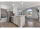 Bright kitchen with stainless steel appliances, a breakfast bar, and an open view into the living area at 7675 E Mcdonald Dr # 107, Scottsdale, AZ 85250