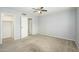 Bedroom featuring a ceiling fan, neutral walls, and open closet at 7827 E Parkview Dr, Mesa, AZ 85208
