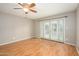 Bedroom with french doors that lead to an outdoor space with a ceiling fan at 7827 E Parkview Dr, Mesa, AZ 85208
