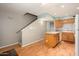 Functional kitchen with a breakfast bar, white appliances, and easy access to the stairs at 7827 E Parkview Dr, Mesa, AZ 85208