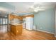 Bright kitchen boasts wooden cabinets, a breakfast bar, and a complete set of white appliances at 7827 E Parkview Dr, Mesa, AZ 85208