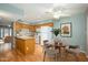 Well-lit kitchen with wooden cabinets, a breakfast bar, and modern appliances, with a dining area at 7827 E Parkview Dr, Mesa, AZ 85208
