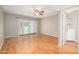 Spacious living room with hardwood floors, ceiling fan, and lots of natural light through the doors at 7827 E Parkview Dr, Mesa, AZ 85208