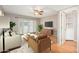 Stylishly decorated living room featuring hardwood floors, a ceiling fan, and modern decor at 7827 E Parkview Dr, Mesa, AZ 85208