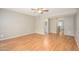 Bright, open living room with hardwood floors, ceiling fan, and neutral paint at 7827 E Parkview Dr, Mesa, AZ 85208