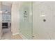 This bathroom features a modern glass shower with decorative marble-style tile work and a chrome showerhead at 8026 S 6Th Dr, Phoenix, AZ 85041
